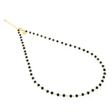 Collana oro con perline nere